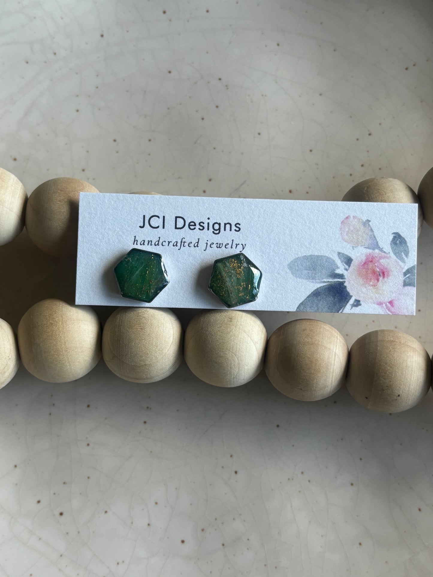 Hexagon studs in emerald