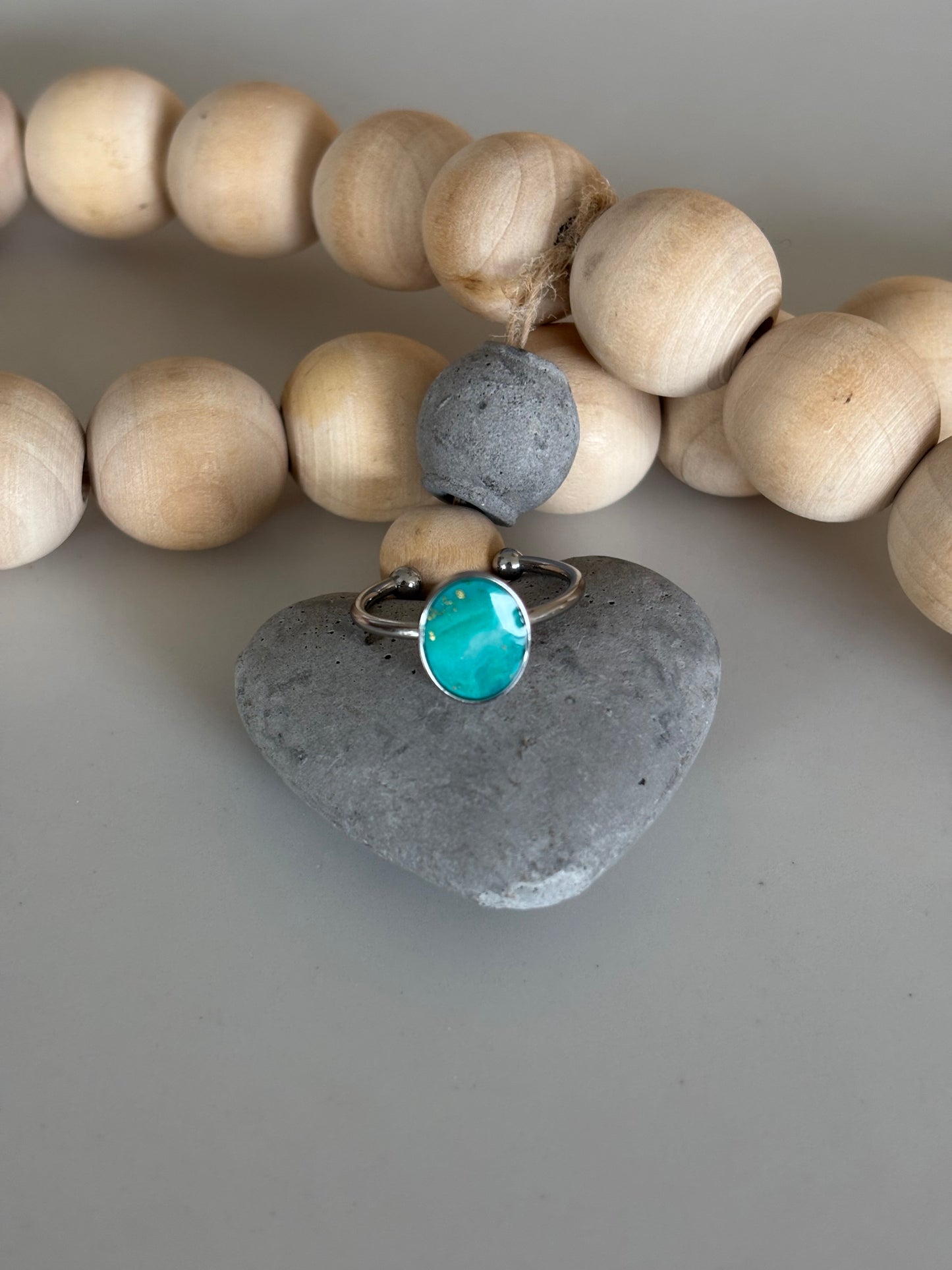 Silver oval ring in teal