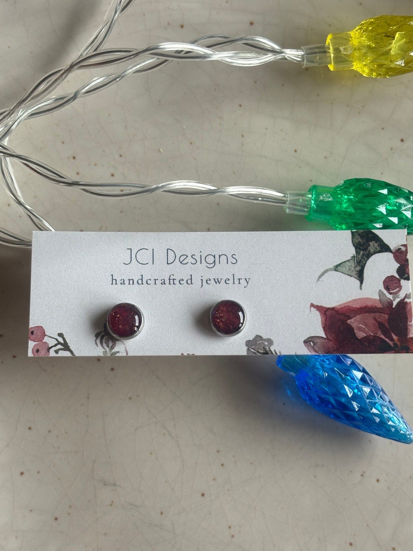 Silver micro studs in sparkling Merlot