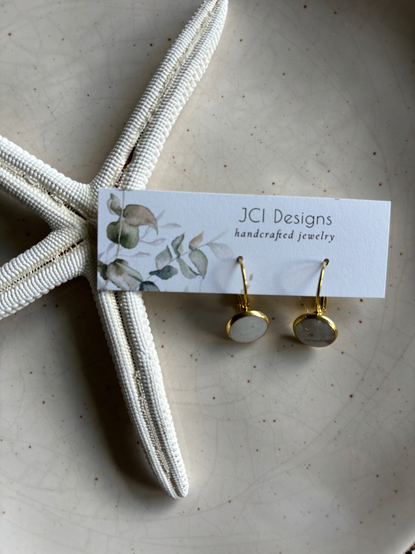 Gold Huggies in white