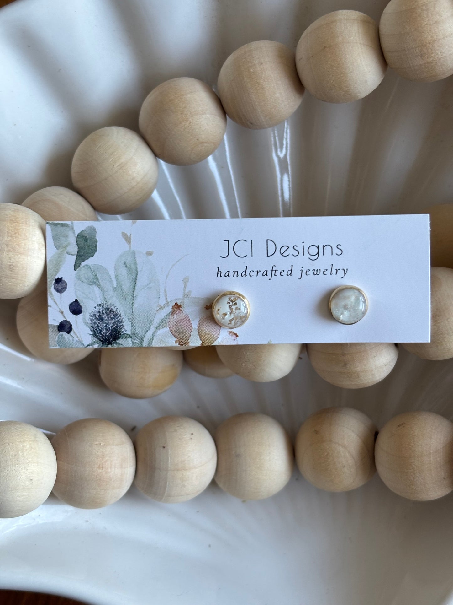 Gold micro studs in white