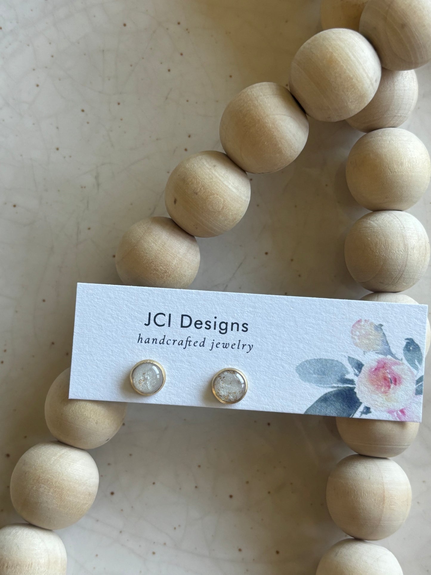 Gold micro studs in white