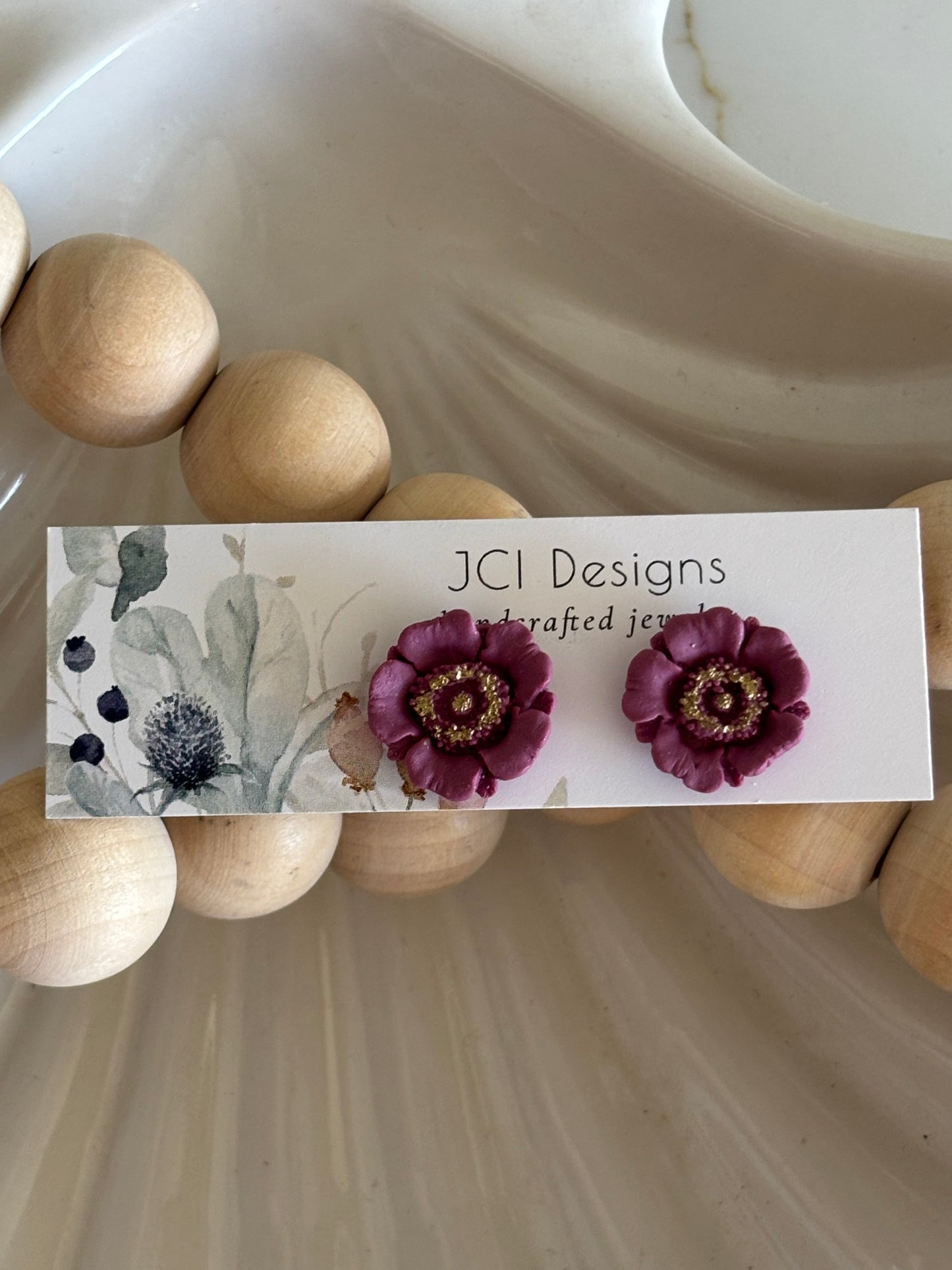 Poppy studs in purple