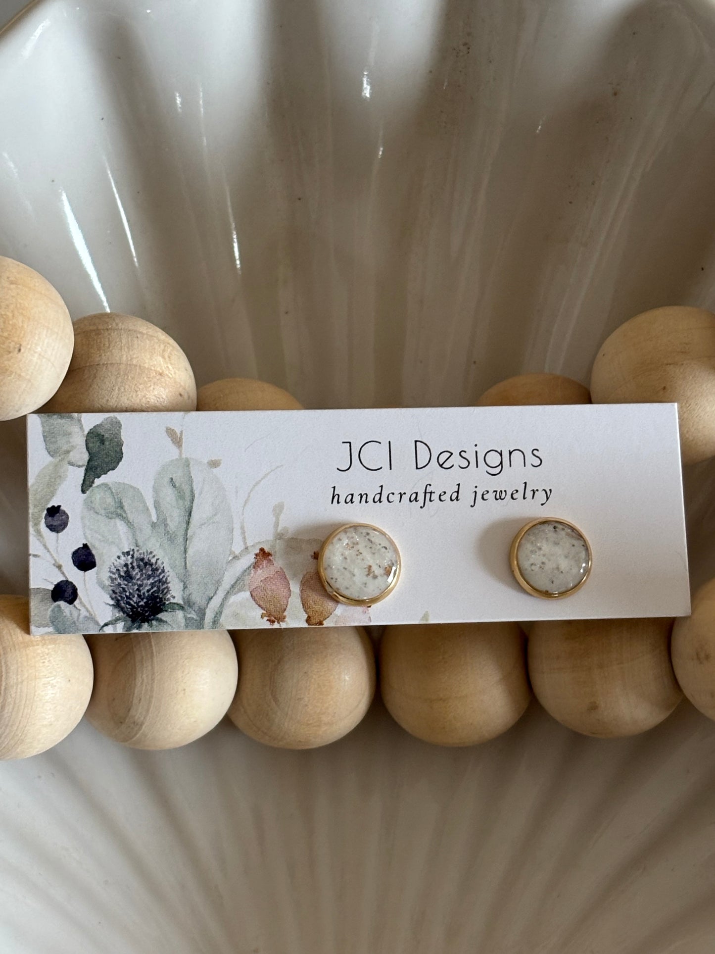 Gold midsized studs in white