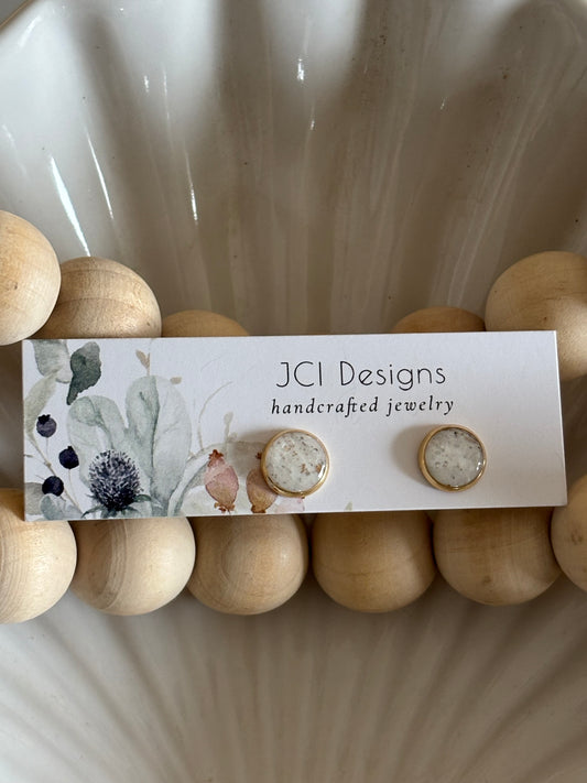 Gold midsized studs in white