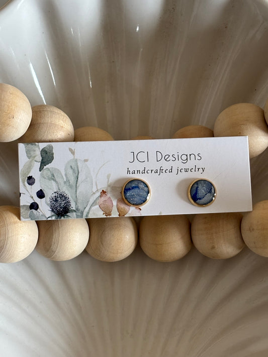 Gold midsized studs in frost blue