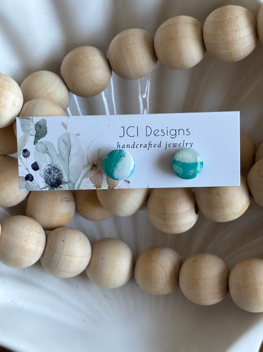 Button studs in teal and white