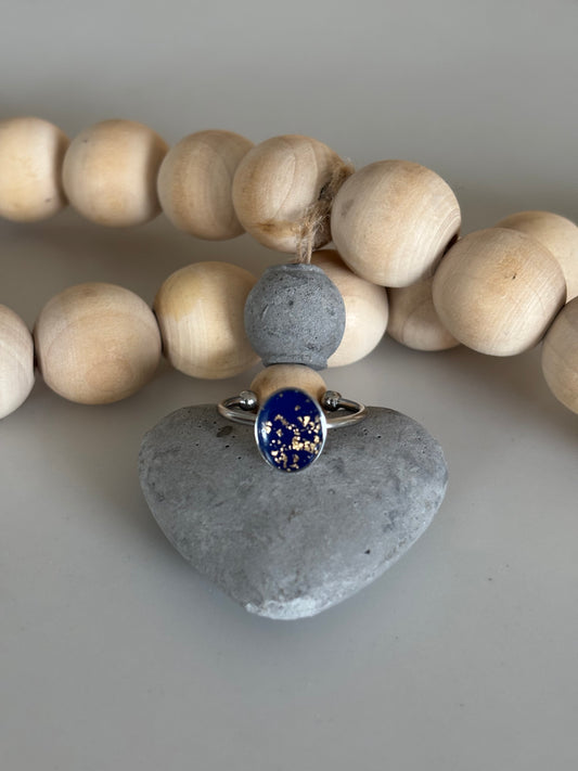 Silver oval ring in midnight blue