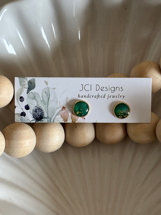 Gold midsized studs in emerald
