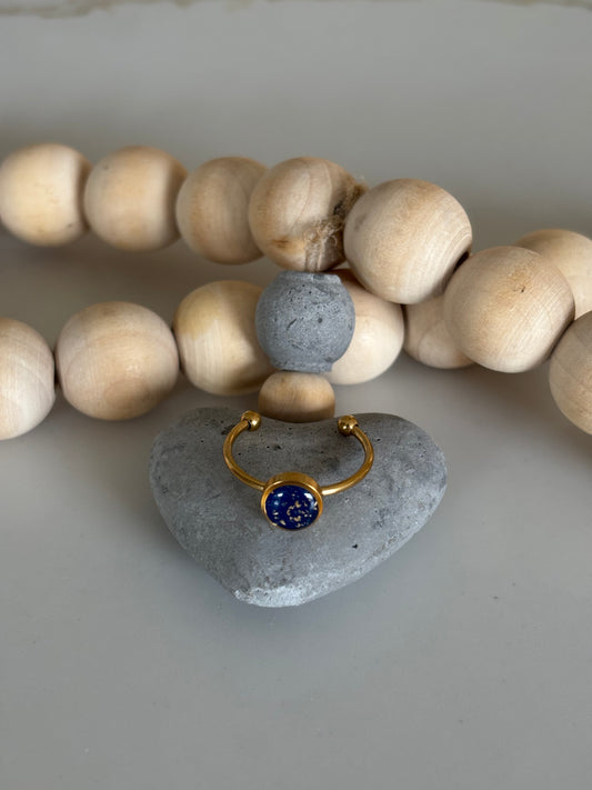 Gold circle ring in midnight blue