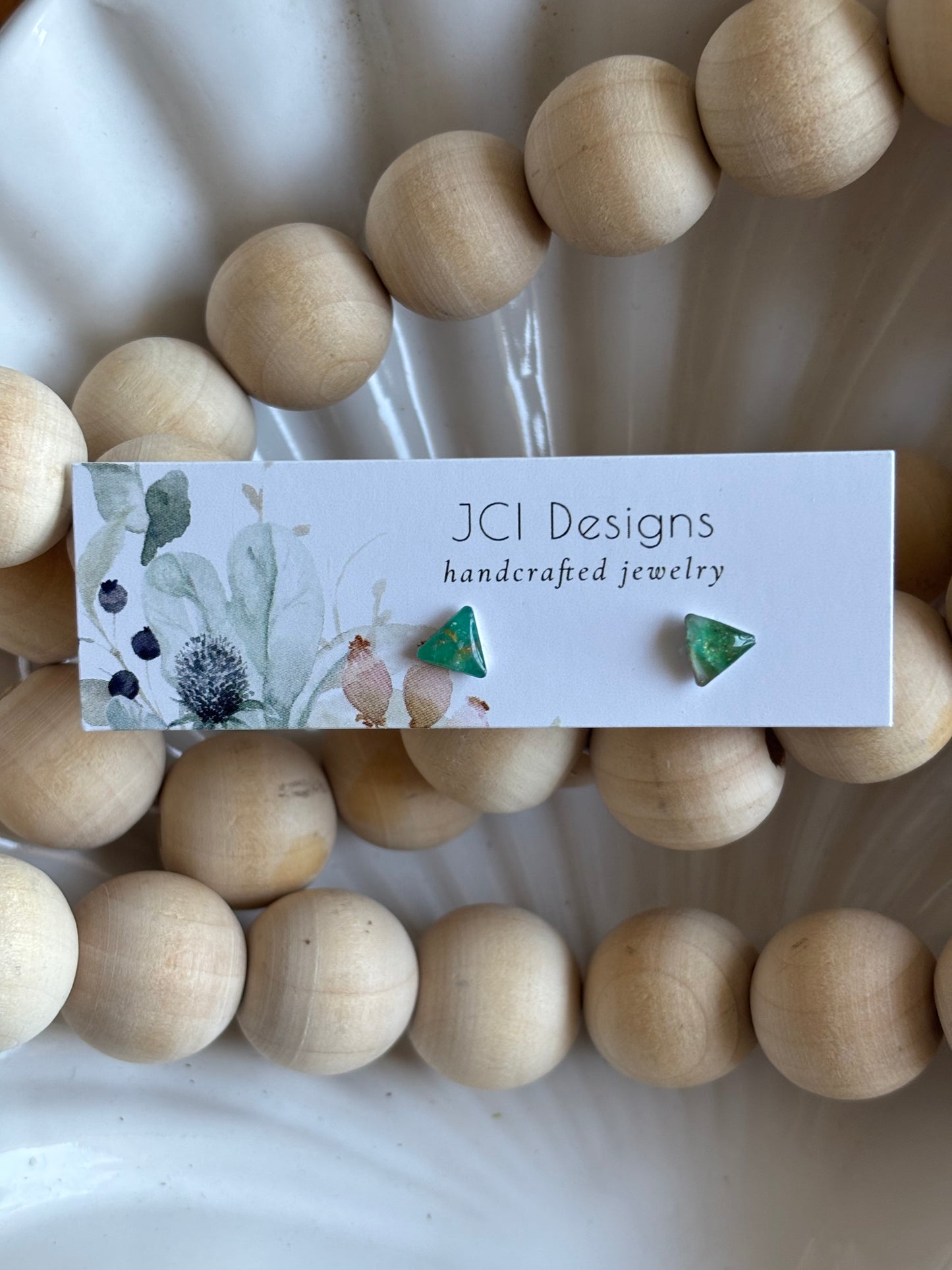 Triangle micro studs in emerald