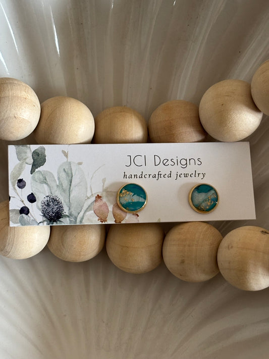 Gold midsized studs in ocean green